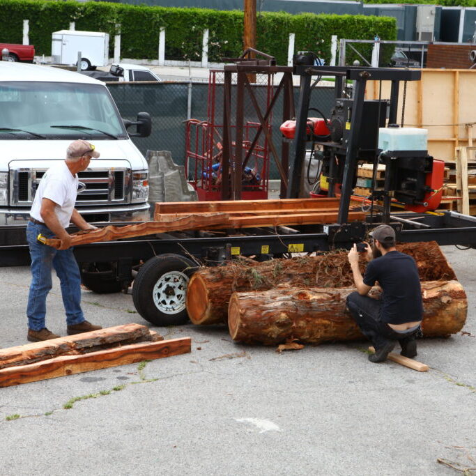 cutting logs in the parking lot